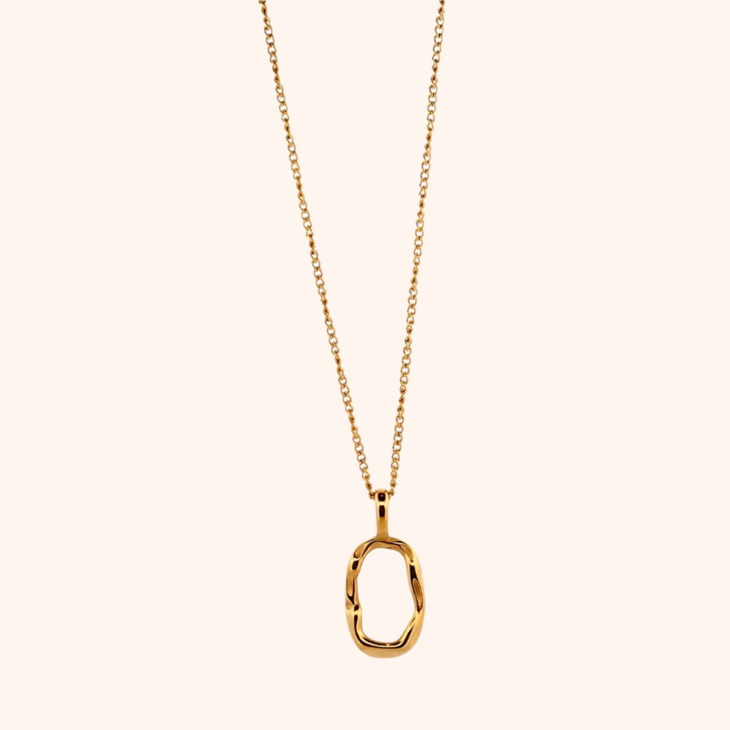 The Cozumel Necklace, a dainty chain necklace with an oval pearl charm, laid flat to display its classic yet contemporary design.