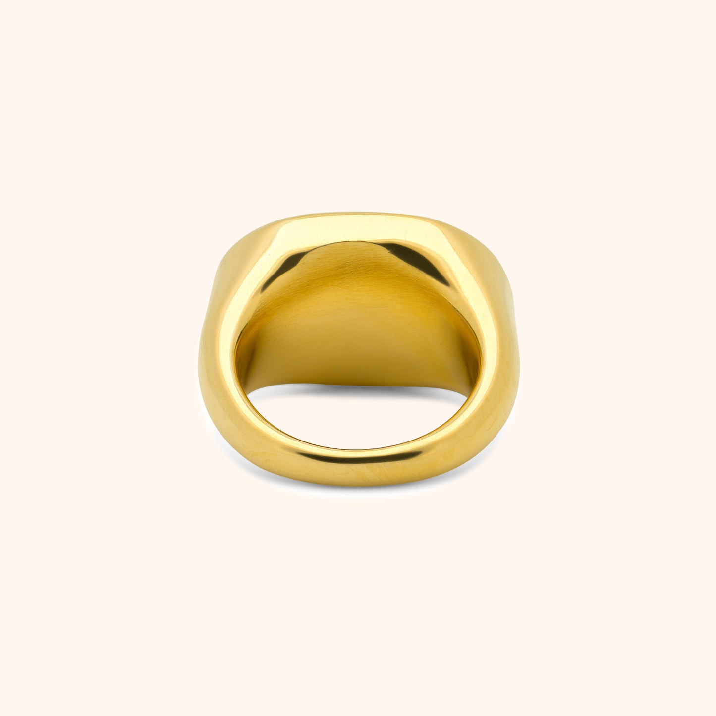 Back view of gold ring showing polished interior and curved band