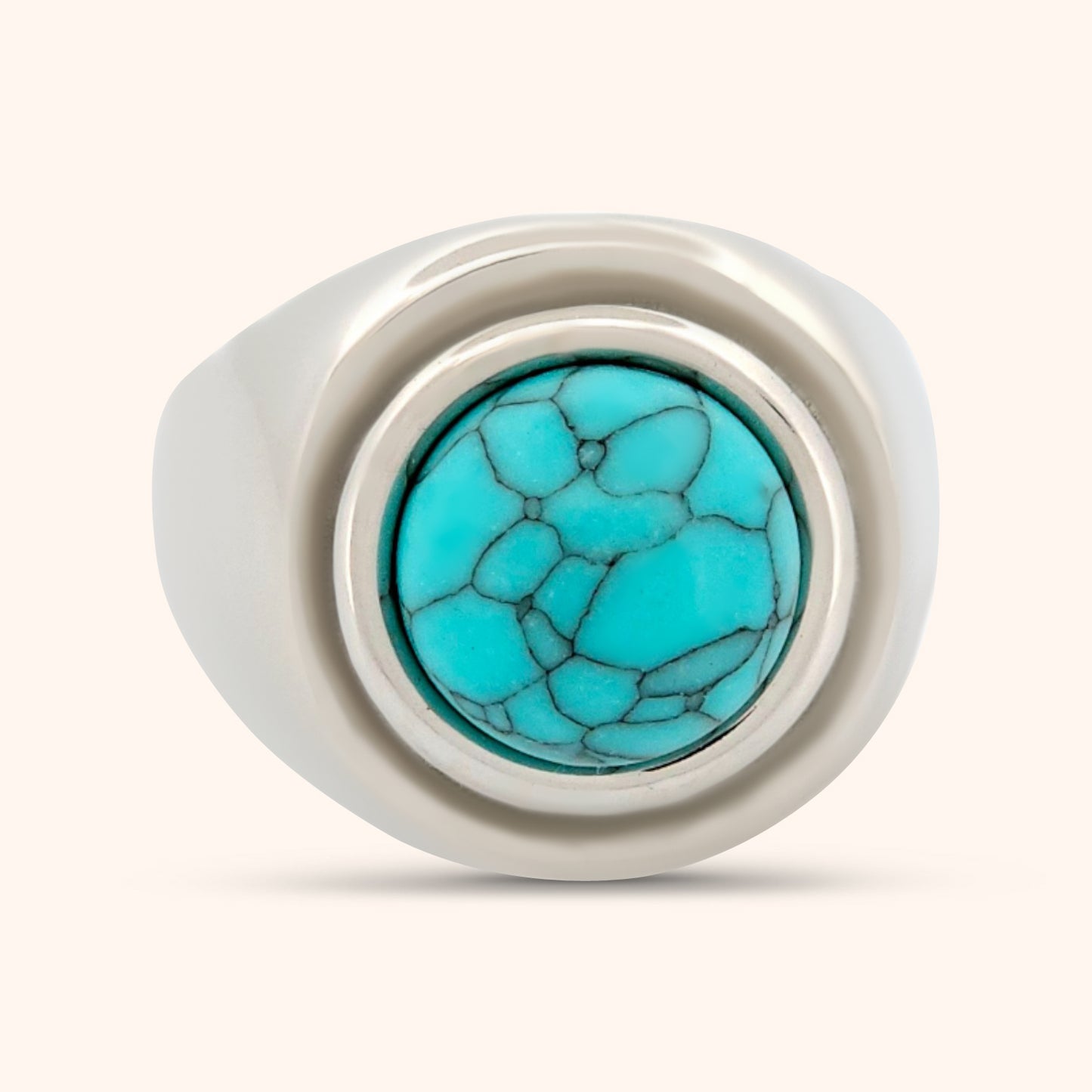 The Morocco Ring on a finger, demonstrating its bold and sophisticated statement design with a vibrant turquoise dome.
