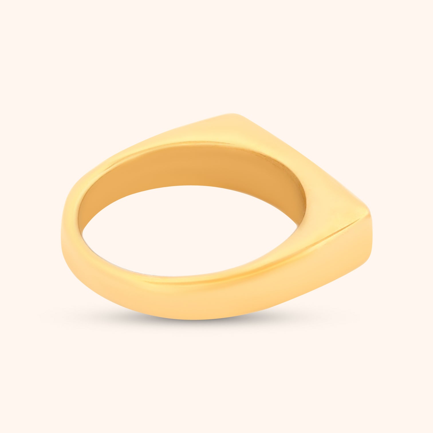 The Kailua Ring on a finger, demonstrating its modern and elegant design with a sleek rectangular top and subtle mountain motif engravings.