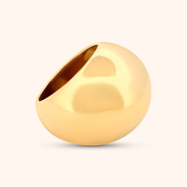 Angled view of The Dubai Ring, highlighting the sleek gold band and the perfectly rounded dome of the ring.
