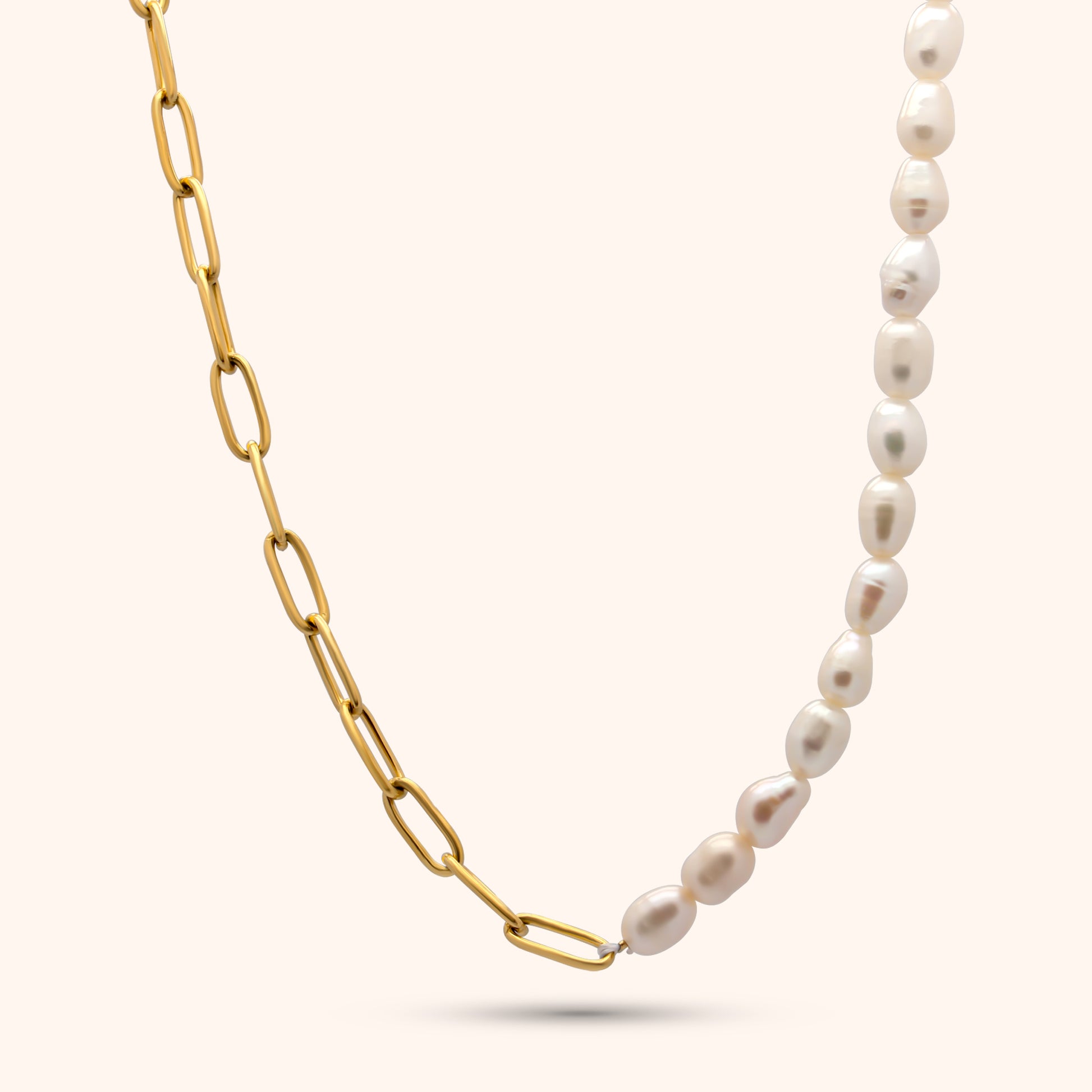 Close-up of the Aurora Chain, a gold paperclip chain necklace with evenly spaced freshwater pearl accents.