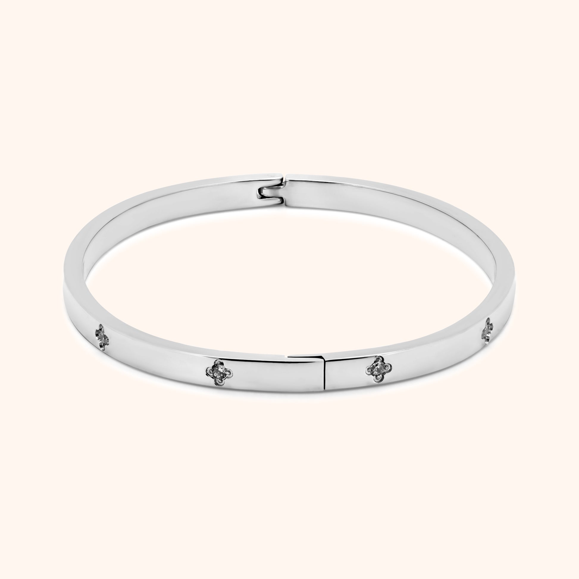 Silver clover bangle bracelet with side hinge and crystal details