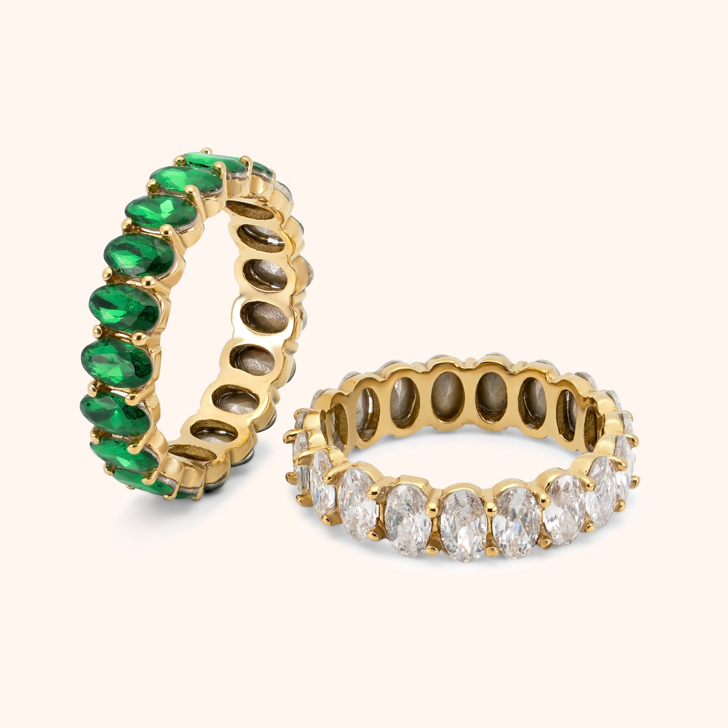 Gold eternity ring with oval-cut clear stones in full circle setting, made of 18k gold plated stainless steel