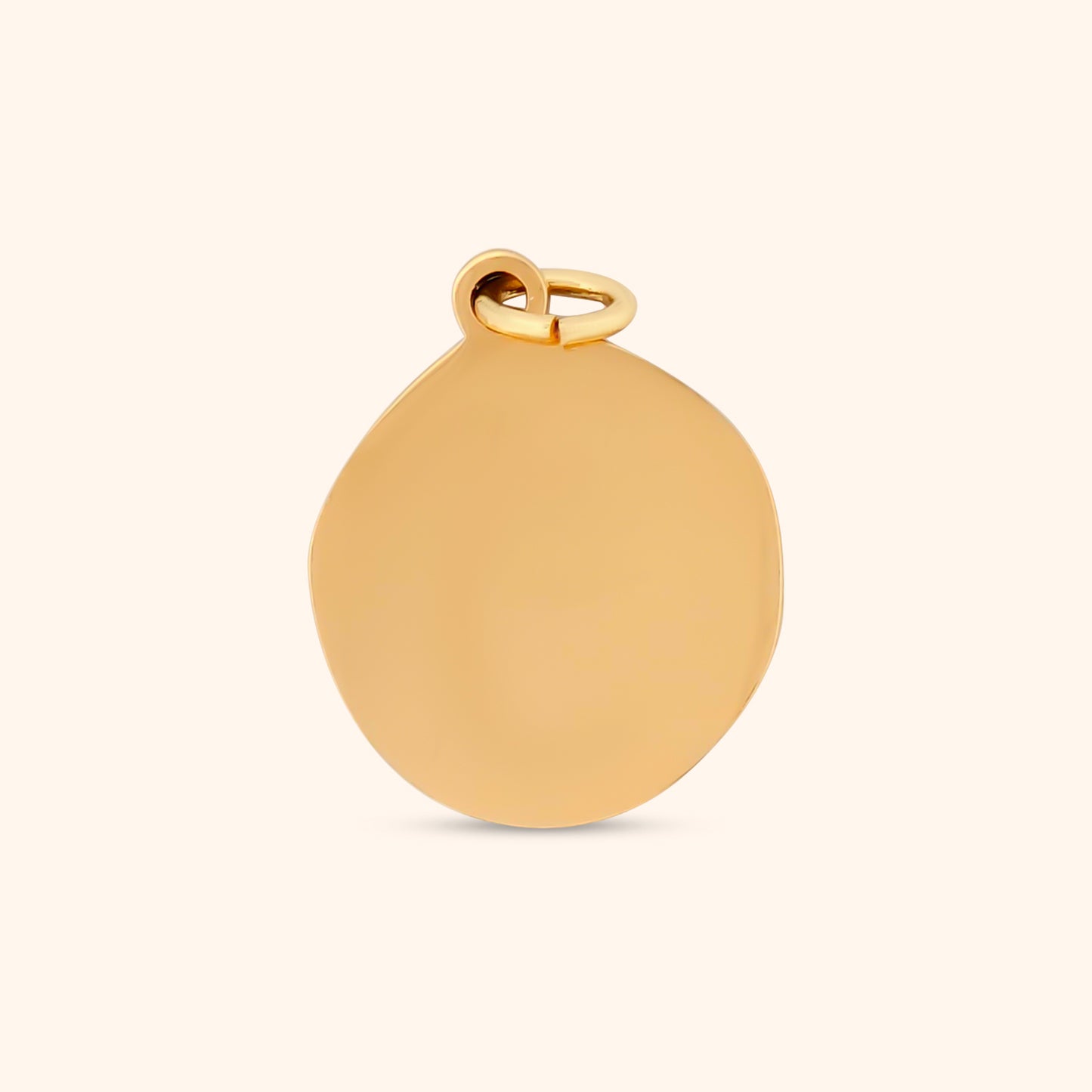 Rear view of the Desert Sun Charm, showcasing the circular gold shape and smooth texture.