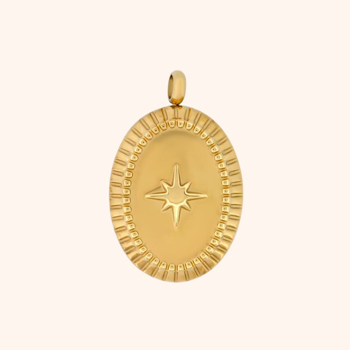 Close-up of the Horizon Charm, an oval-shaped gold charm with a textured surface and a North Star detail.