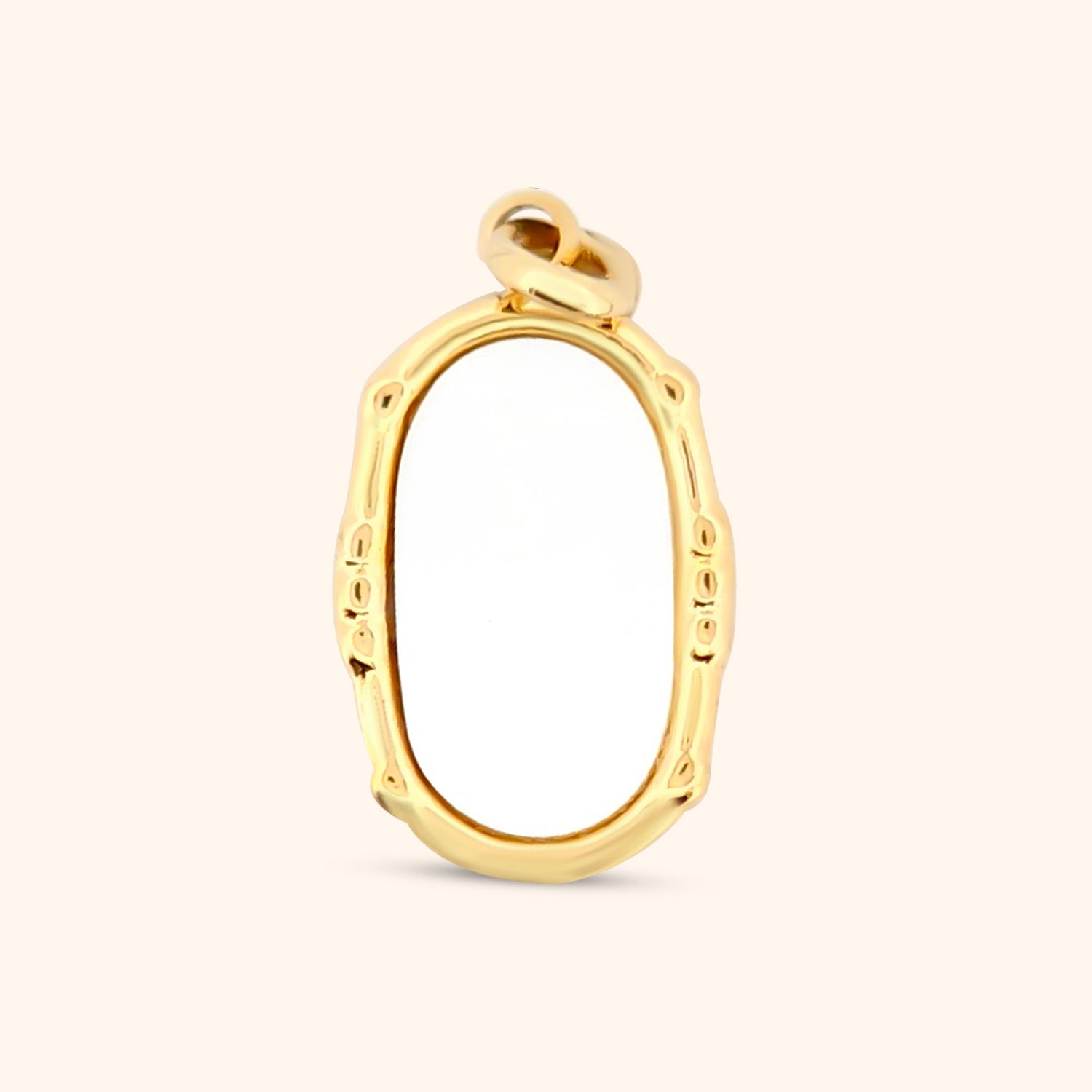 Close-up of the Oceana Charm, an oval-shaped gold charm with a mother-of-pearl inlay.