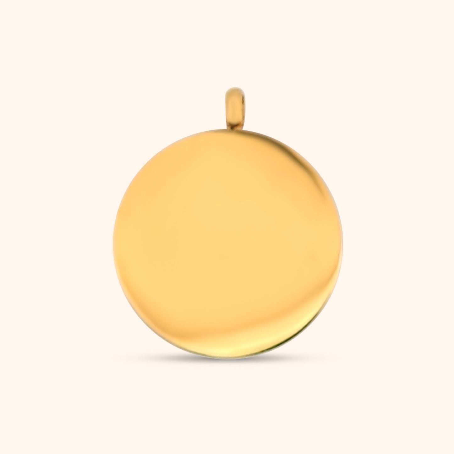 Rear view of the Stella Charm, a gold circular charm, highlighting the North Star detail and the charm's texture.