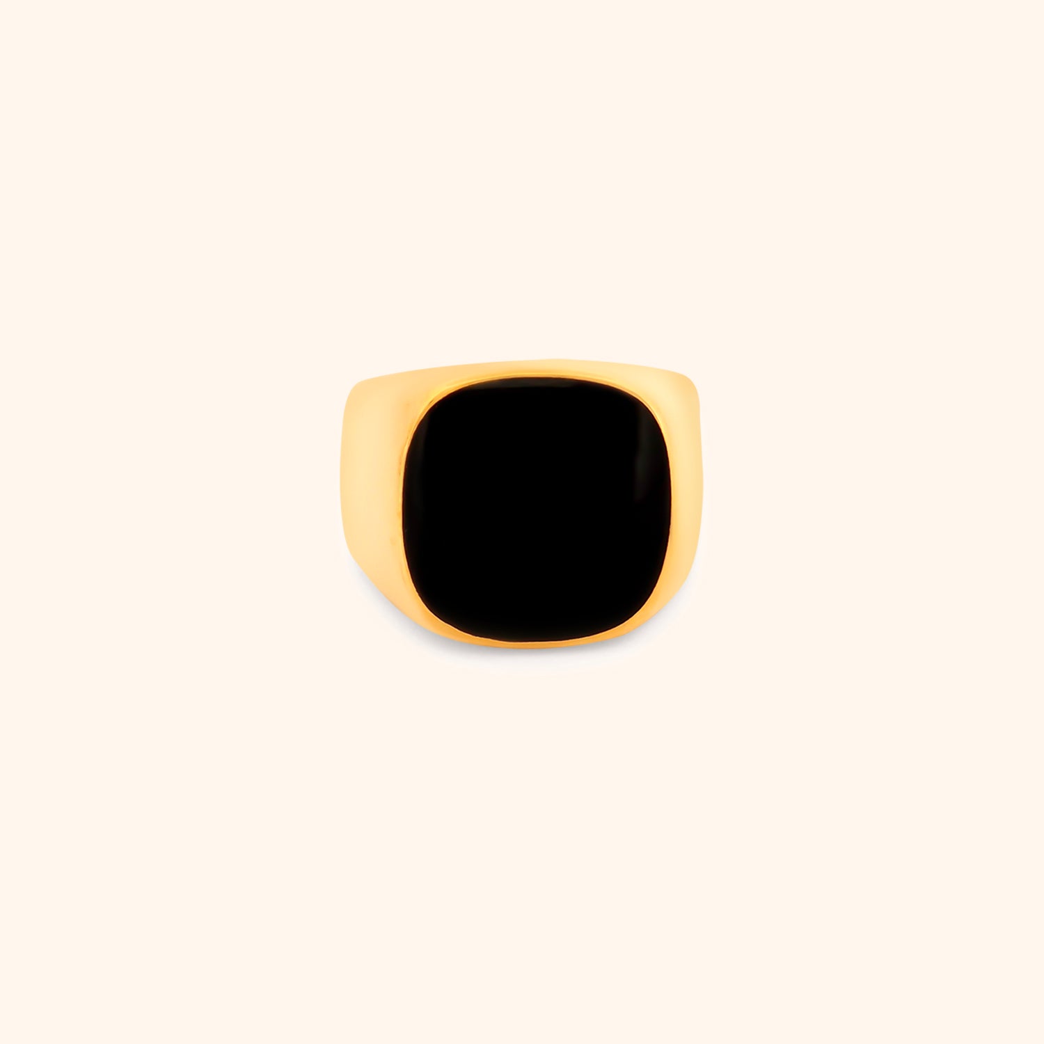 Close-up of the Solstice Ring, a chunky gold ring with a prominent black square top.