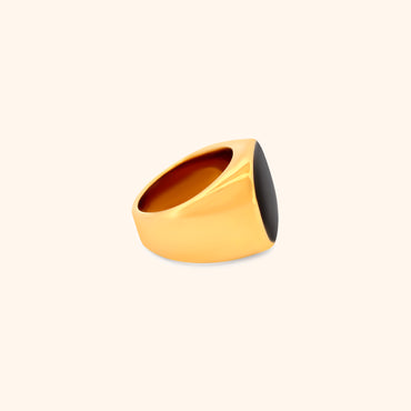Side view of the Solstice Ring, highlighting its chunky gold band and the depth of the black square setting