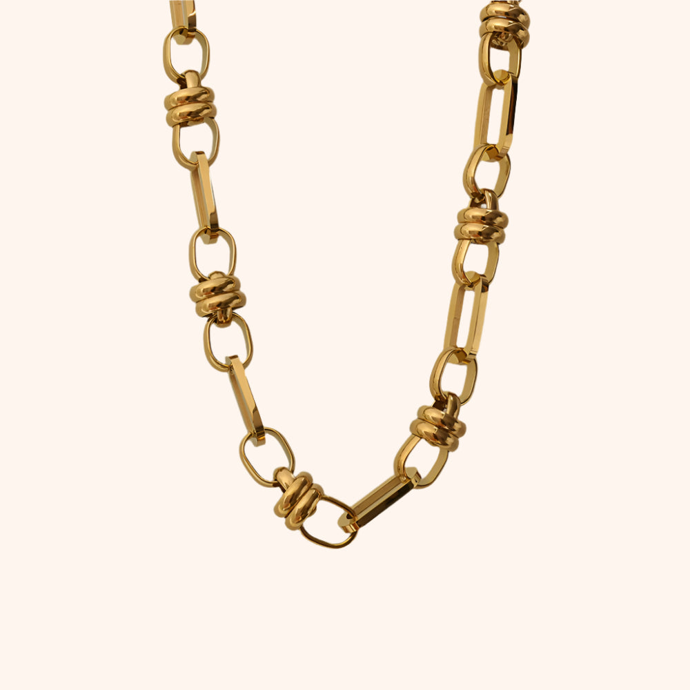 Pressie Chunky Gold Link Statement Necklace, 18K gold plated stainless steel, worn with an evening dress.
