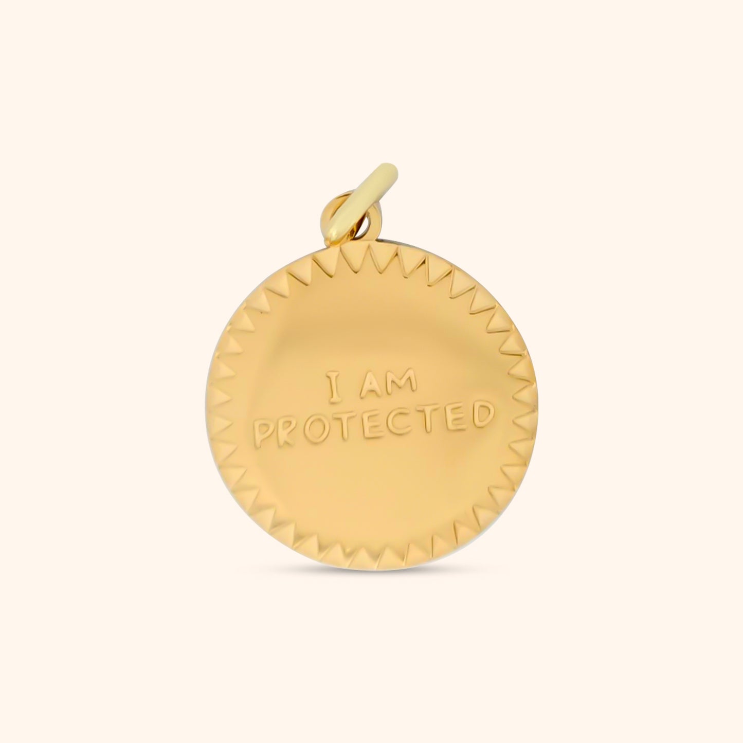 Close-up of the Aegis Charm, a gold charm engraved with the words 'I Am Protected'.