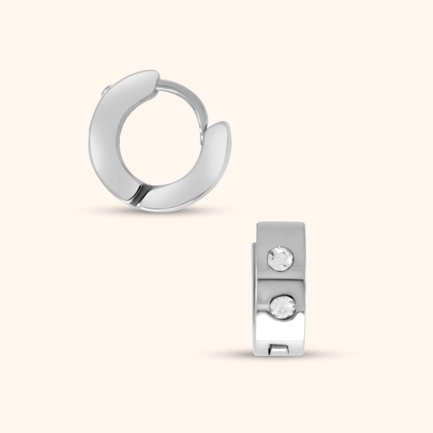 Extreme close-up of a single PRESSIE Aperture Hoop earring, clearly showing the hinge mechanism and the two small, clear, round stones set on the front of the 14k gold-plated hoop.