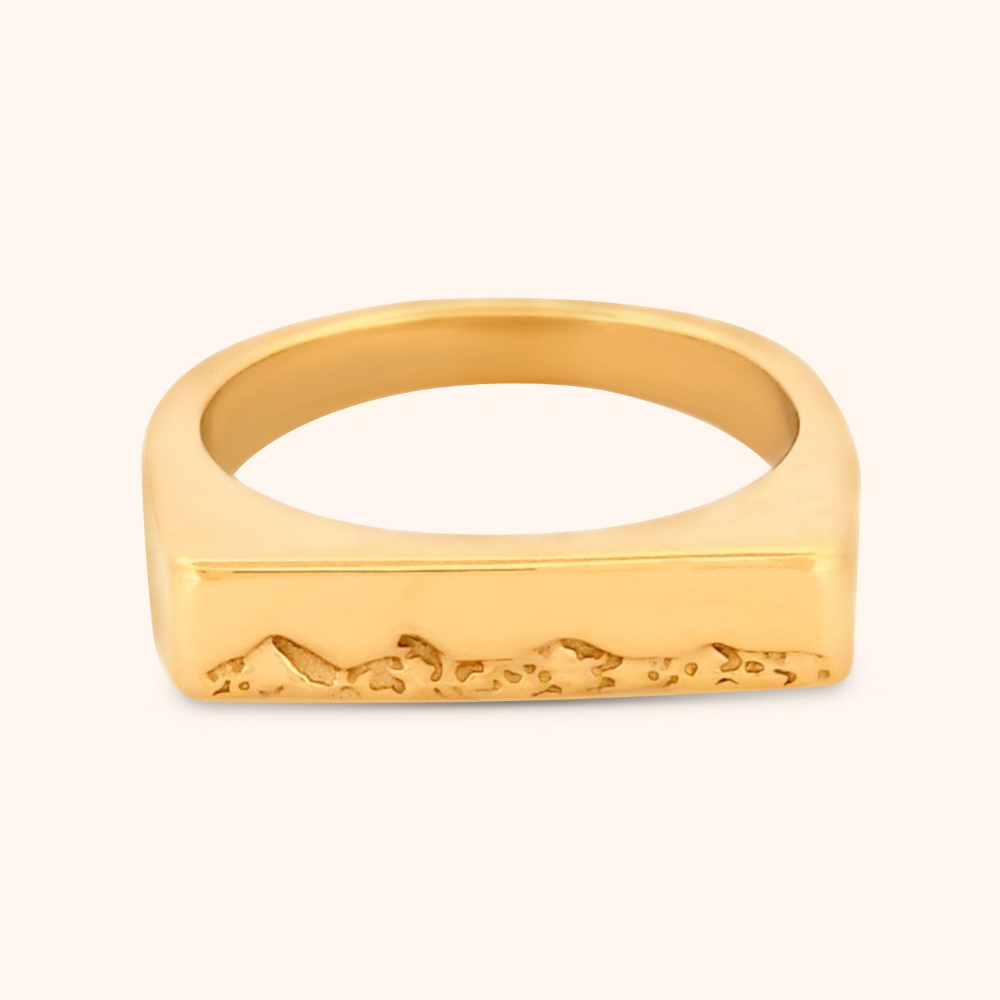 Close-up of the Kailua Ring, showcasing its sleek rectangular top with delicate, engraved triangle mountain motifs, inspired by the landscapes of Kailua, Hawaii.
