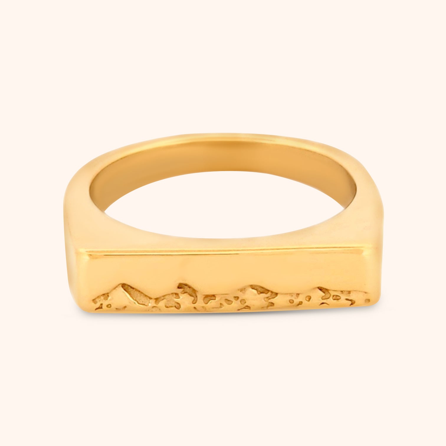 Close-up of the Kailua Ring, showcasing its sleek rectangular top with delicate, engraved triangle mountain motifs, inspired by the landscapes of Kailua, Hawaii.
