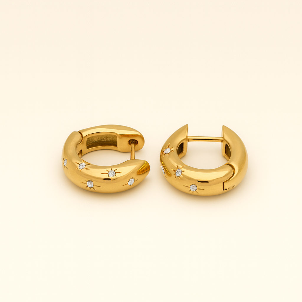 18k gold and stainless steel huggie earrings with crystal star details and smooth curved design