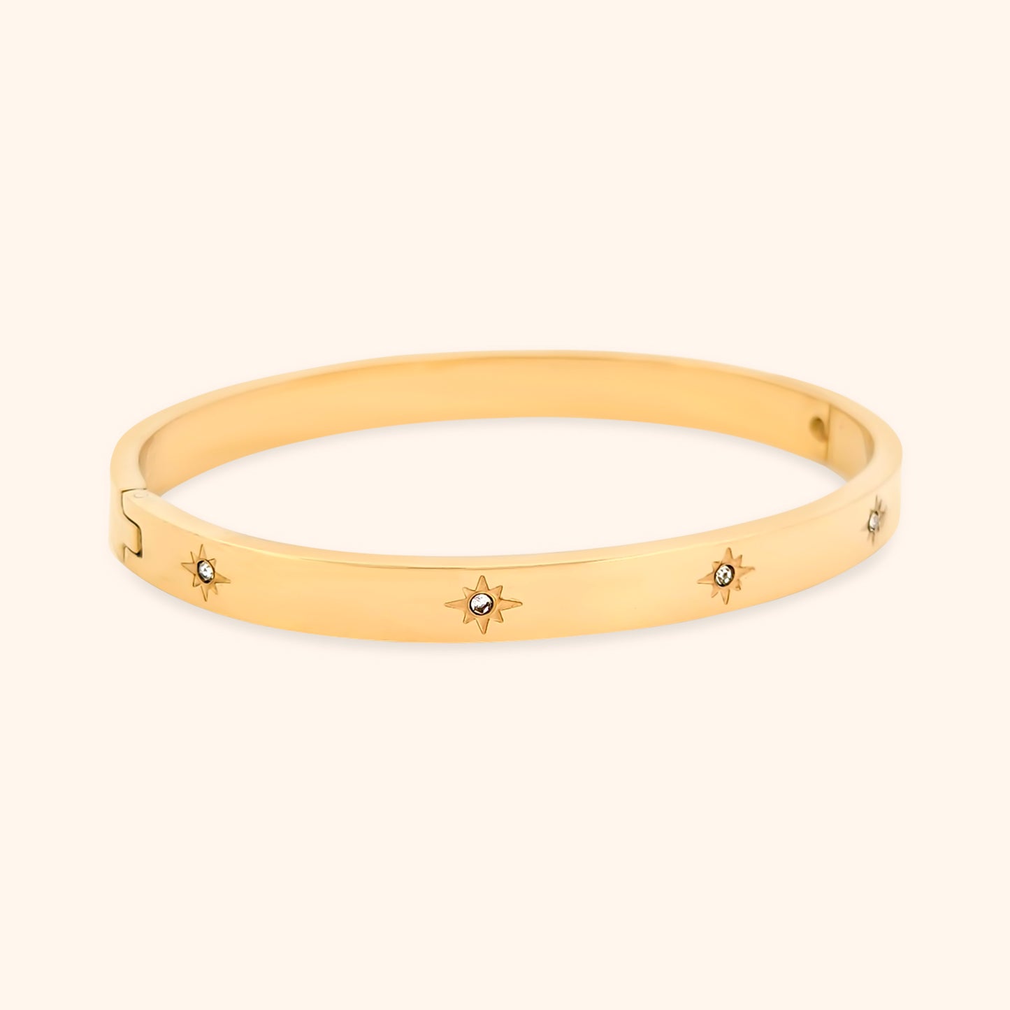 The Starry Night Bangle Bracelet, highlighting its elegant design with celestial star charms and sparkling crystals, perfect for adding a touch of celestial charm to any outfit.