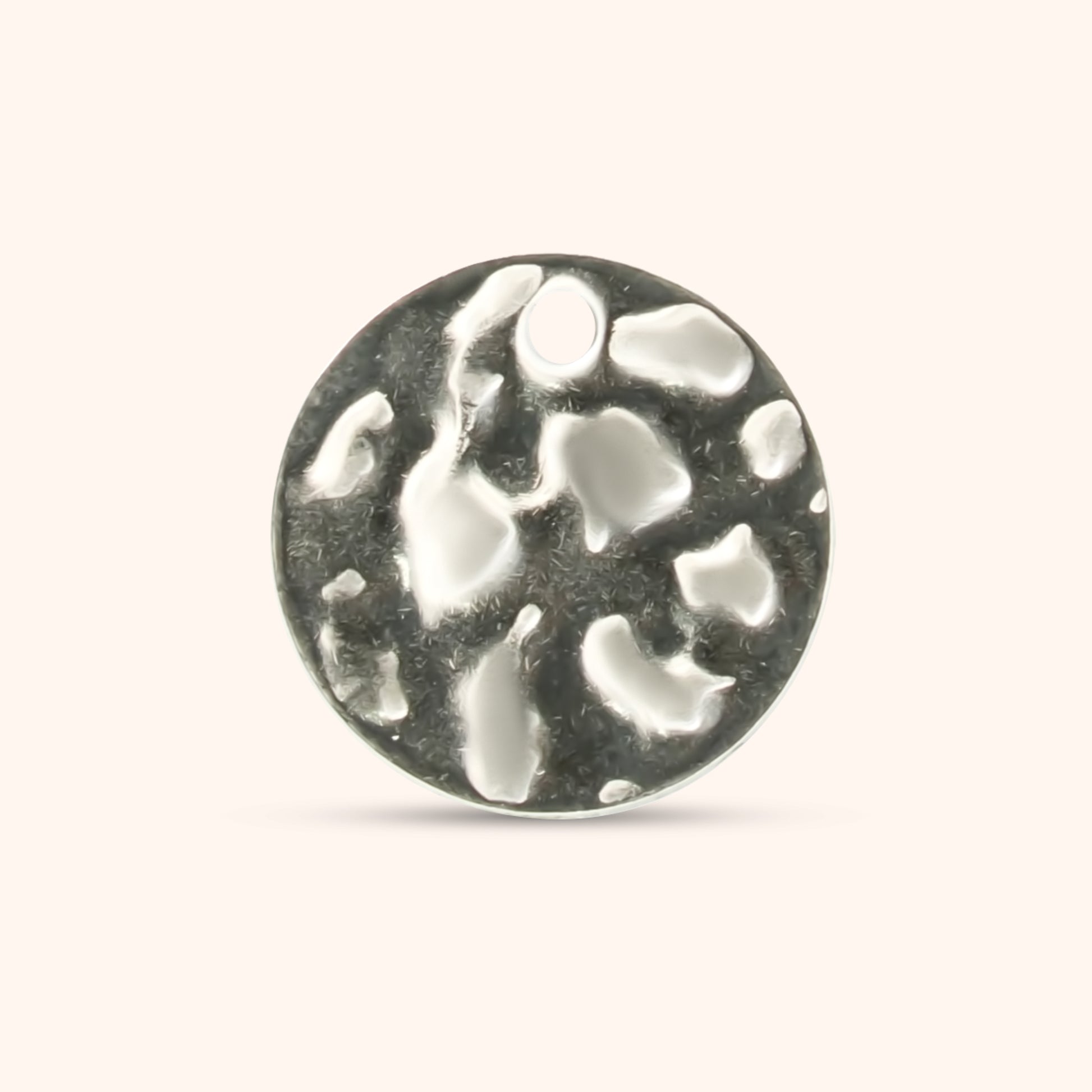 Round hammered silver charm with a small top hole, made of polished stainless steel