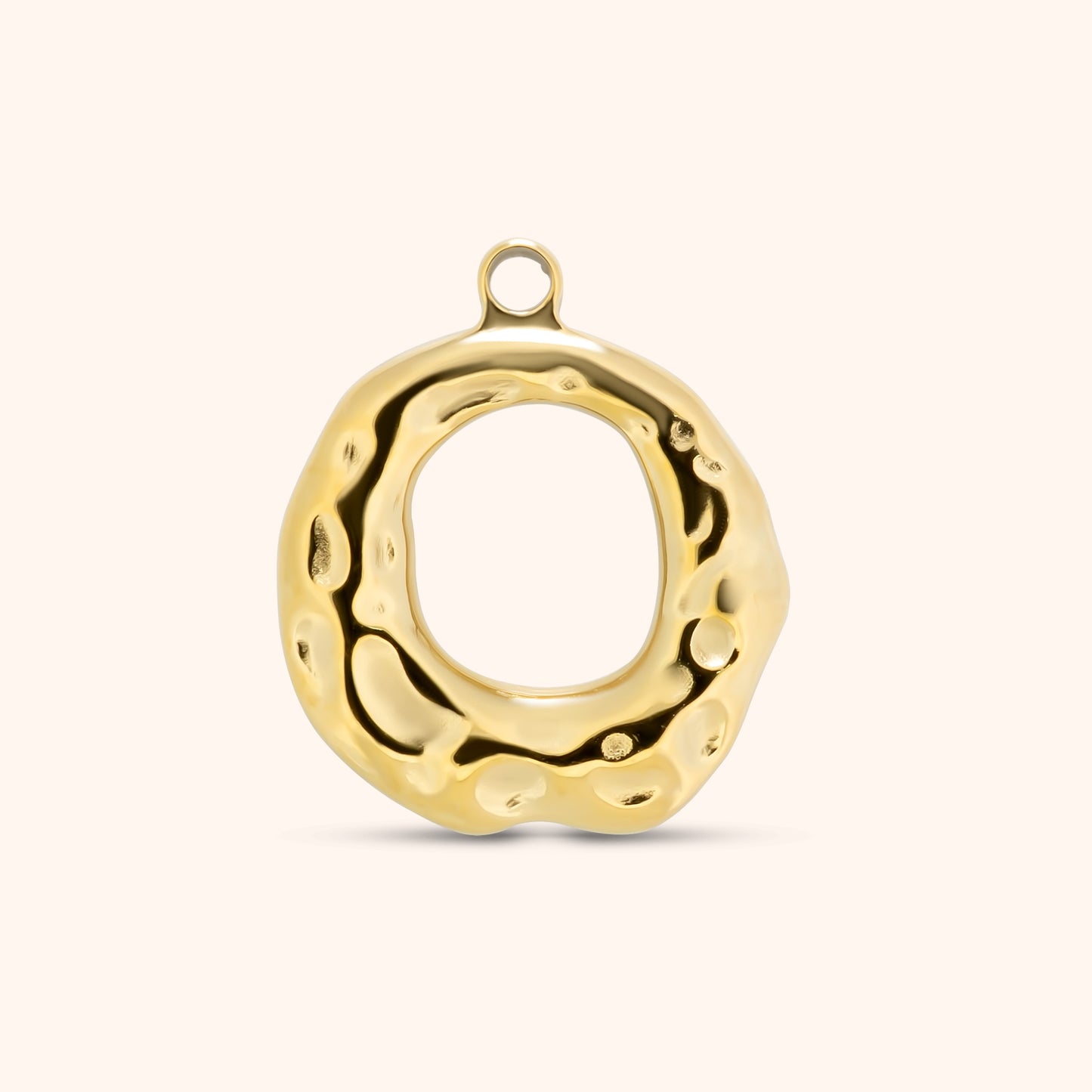 Abstract open circle gold charm with molten, irregular texture and a top loop, made of polished 18k gold plated stainless steel