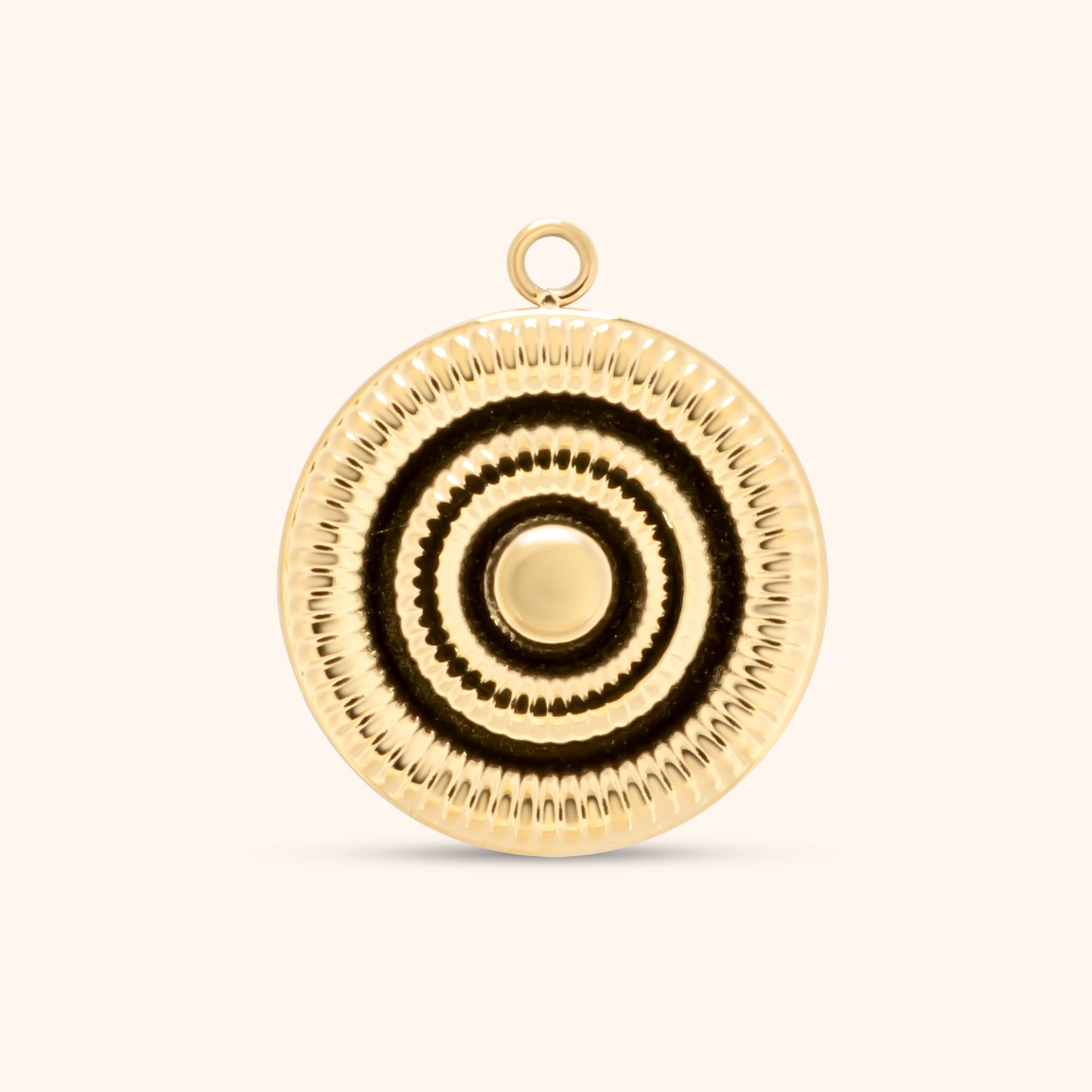 Round gold charm with concentric ridged circles and a smooth center, featuring a top loop for use on necklaces or bracelets