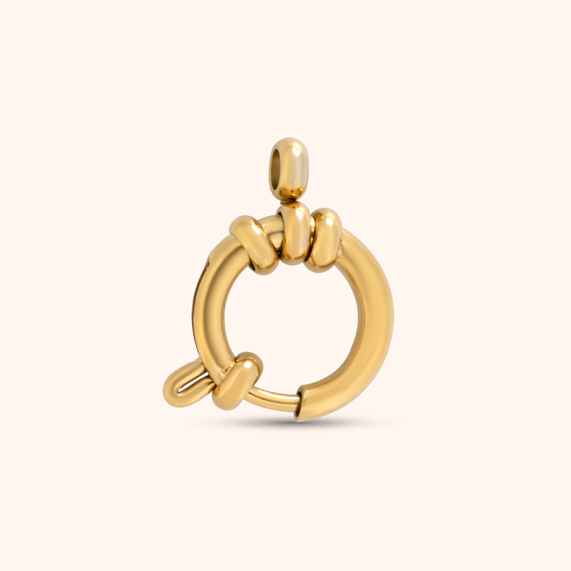 PRESSIE Gathering Clasp; an 18k gold plated circular spring ring style charm holder with a top bail and decorative knotted details.