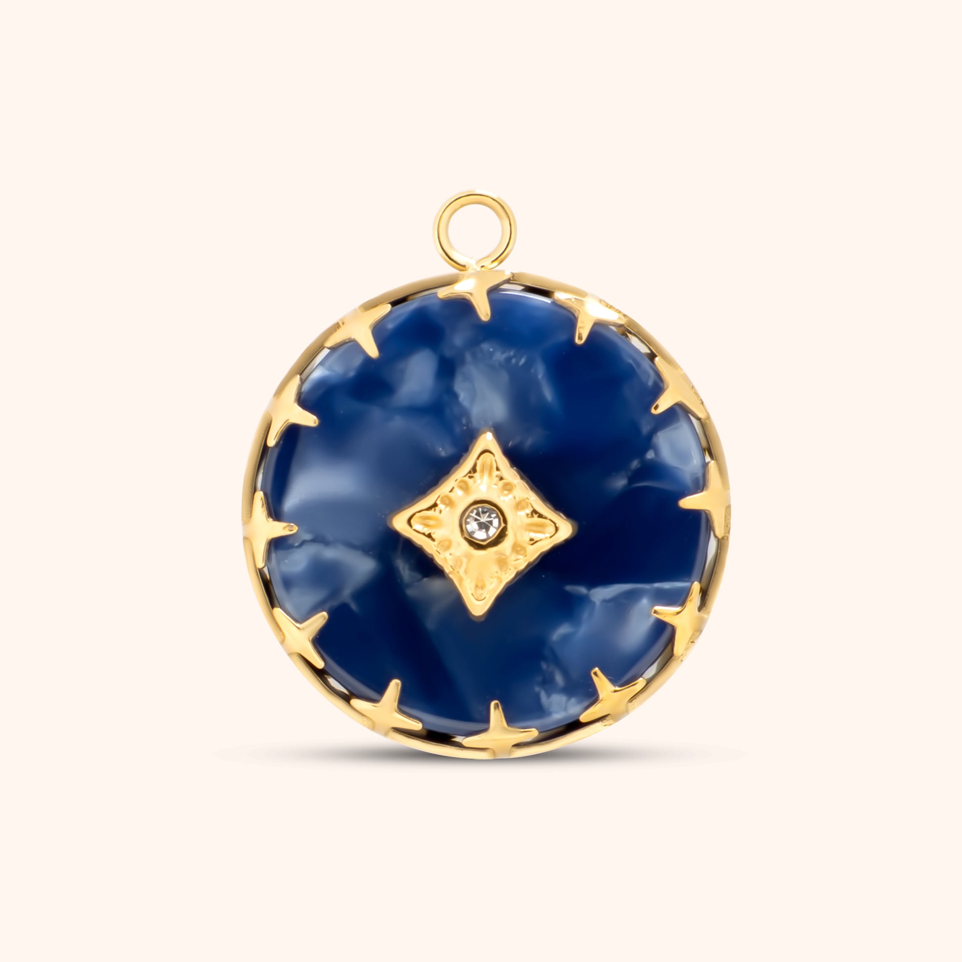 Round blue resin charm with gold starburst setting and center crystal, framed in gold with a top loop for attaching to necklaces or bracelets