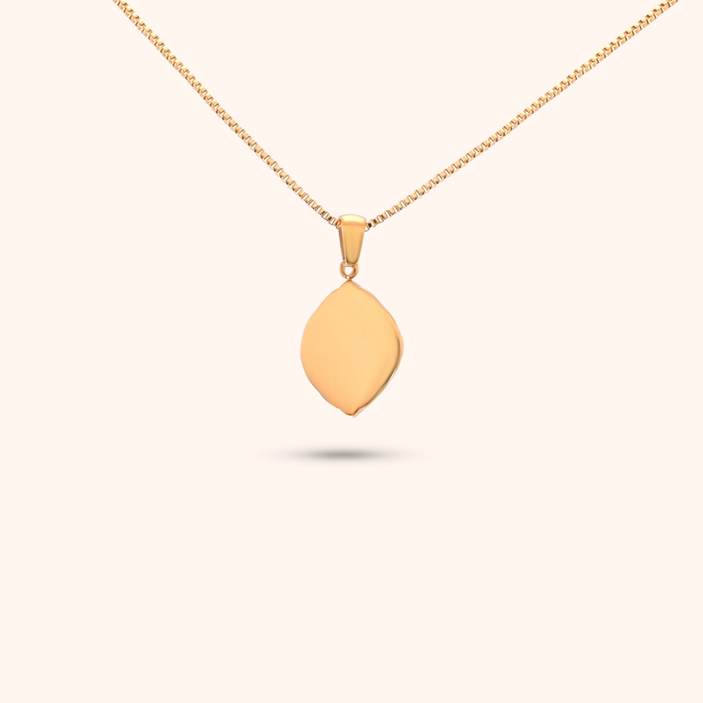 Rear view of the Navigator Pendant, showcasing the gold chain and the intricate design of the geometric pendant.