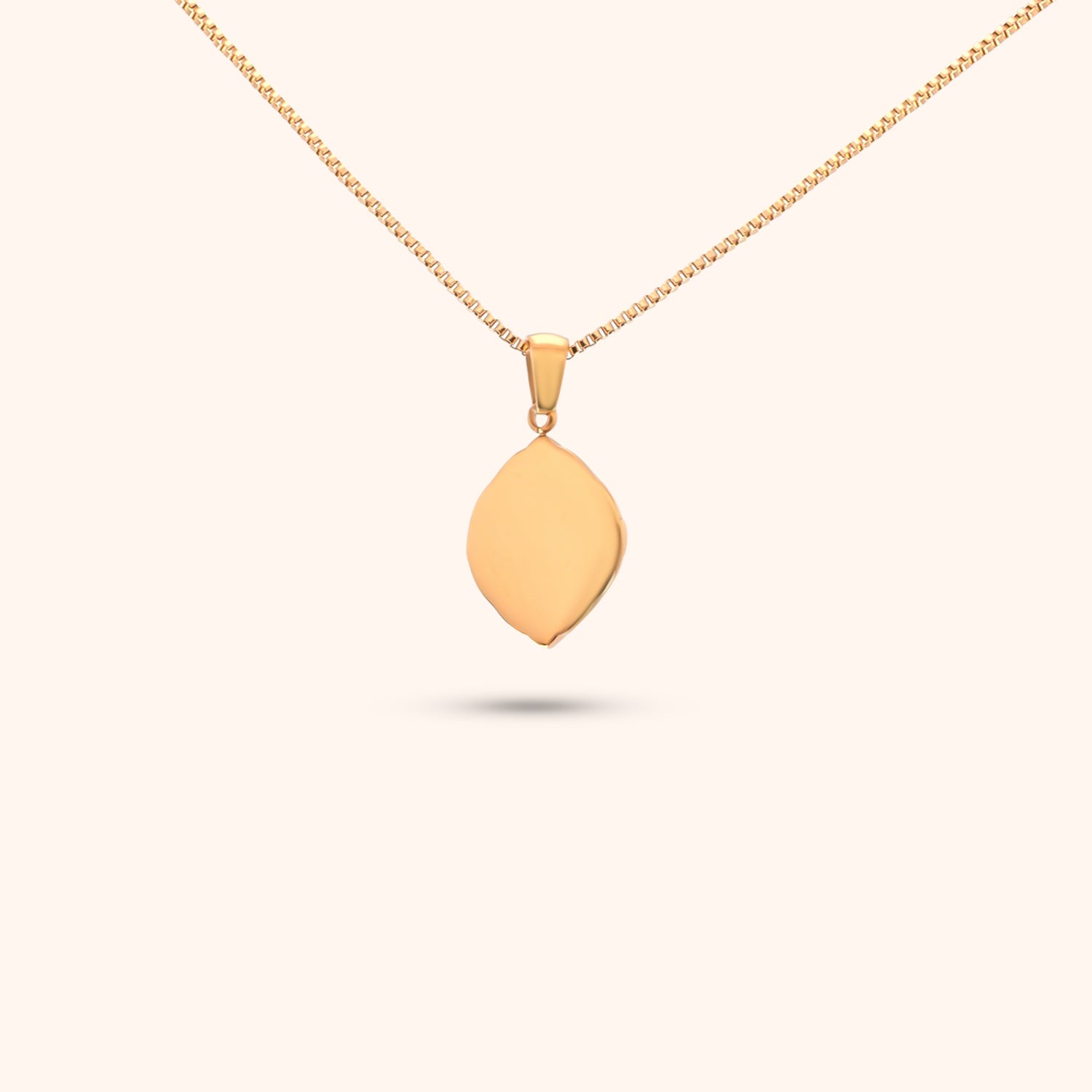 Rear view of the Navigator Pendant, showcasing the gold chain and the intricate design of the geometric pendant.