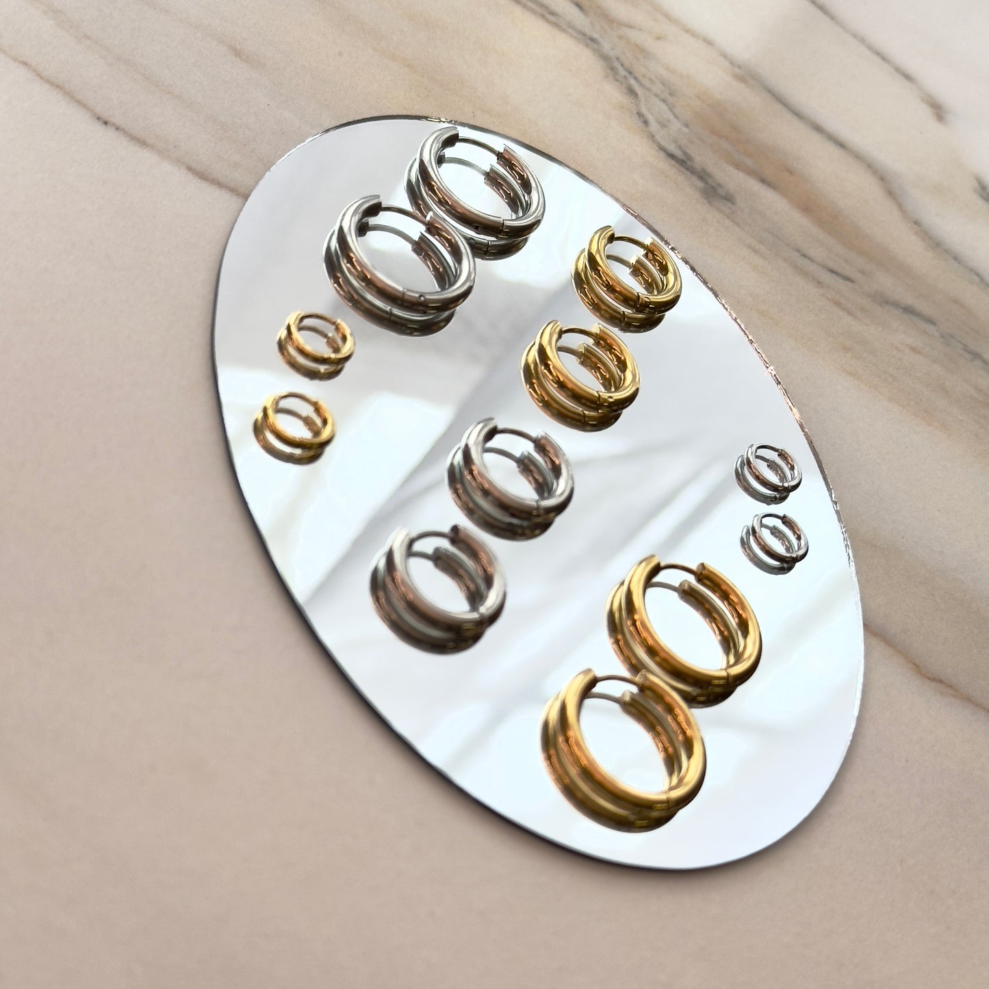 Pressie Perfect Huggie Earrings - Small, 14K gold plated stainless steel,  showing multiple earrings for styling options.
