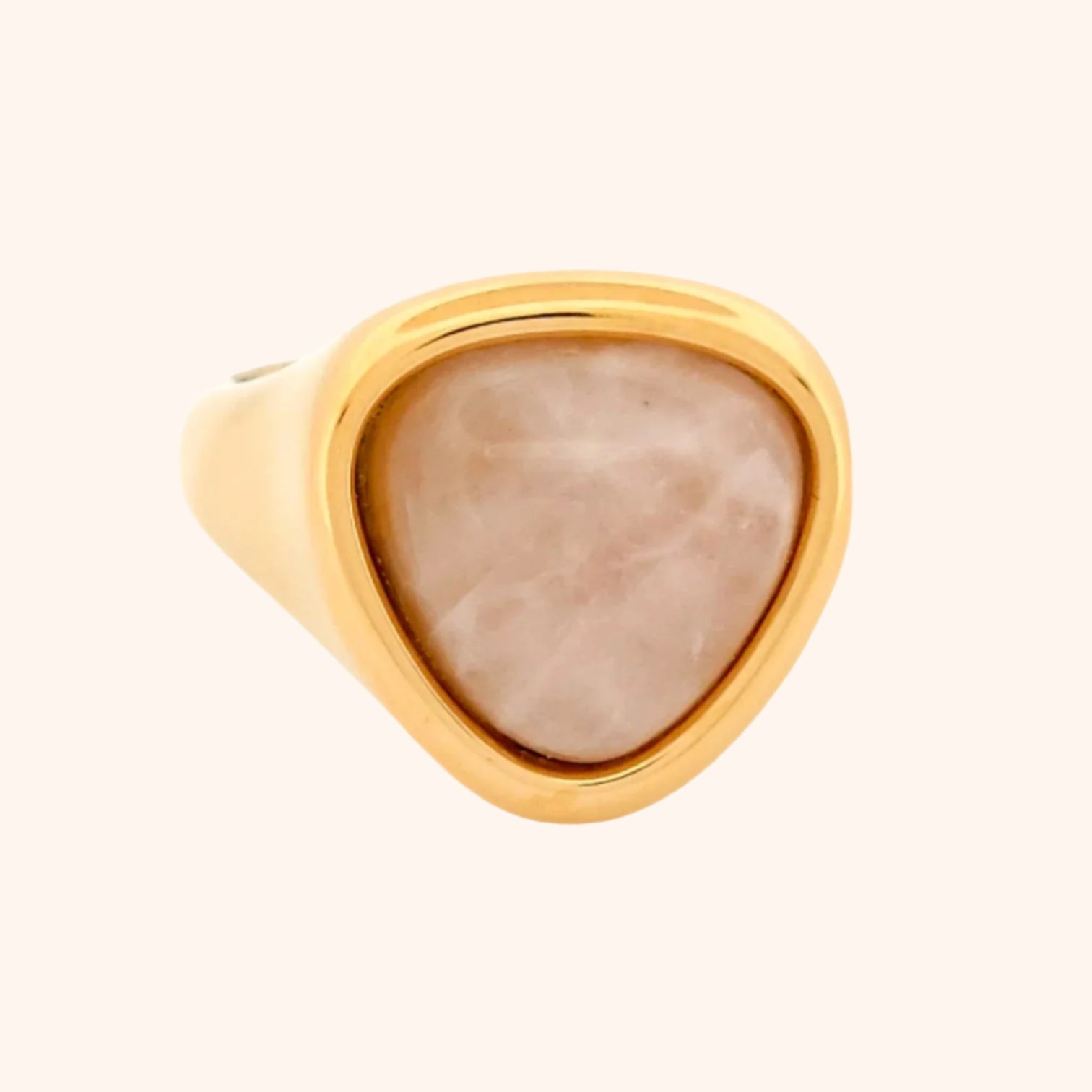 The Idar Ring with a Rose Quartz gemstone on a hand, demonstrating its elegant and versatile design.