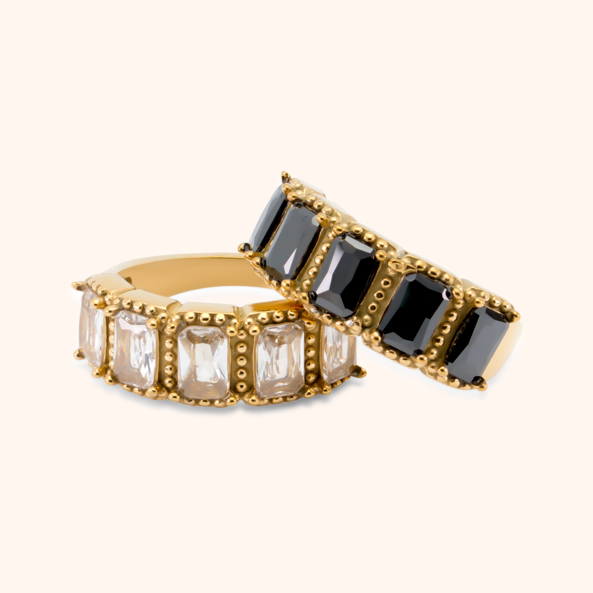 Gold statement ring with rectangular clear gemstones and beaded prong settings, made of 18k gold plated stainless steel