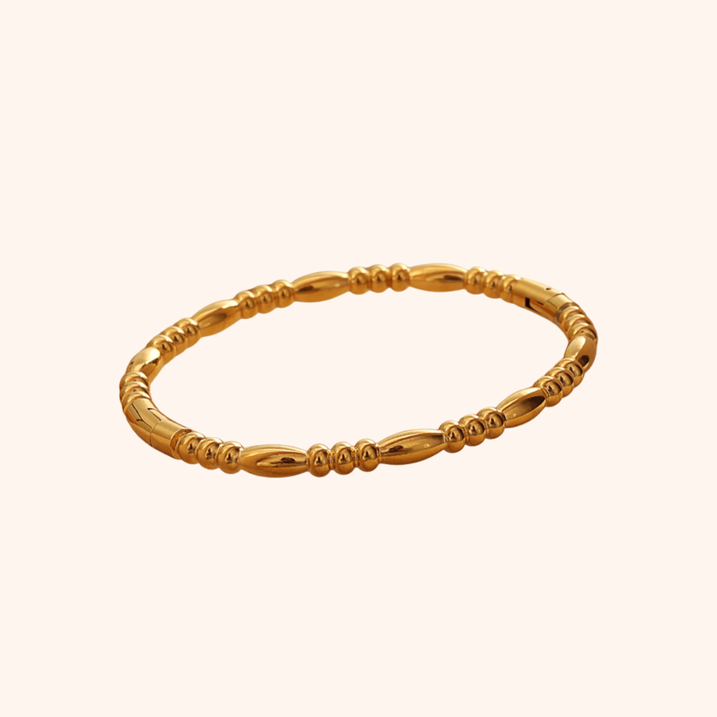 Textured 18k gold bracelet with repeating polished bead and oval-link pattern