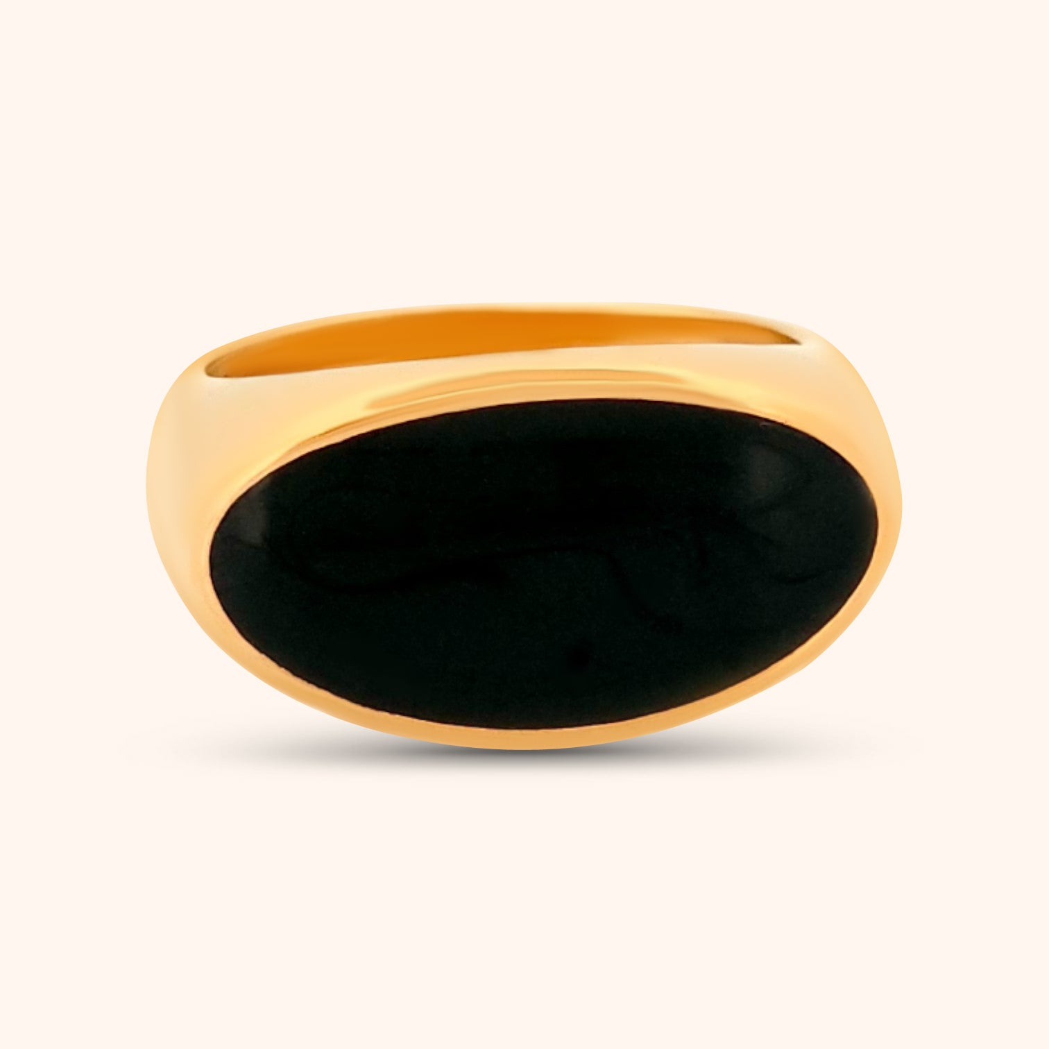 Close-up of The Jaipur Ring, a gold ring featuring a sideways oval Mother of Pearl gemstone, highlighting its iridescent white and subtle shimmer.
