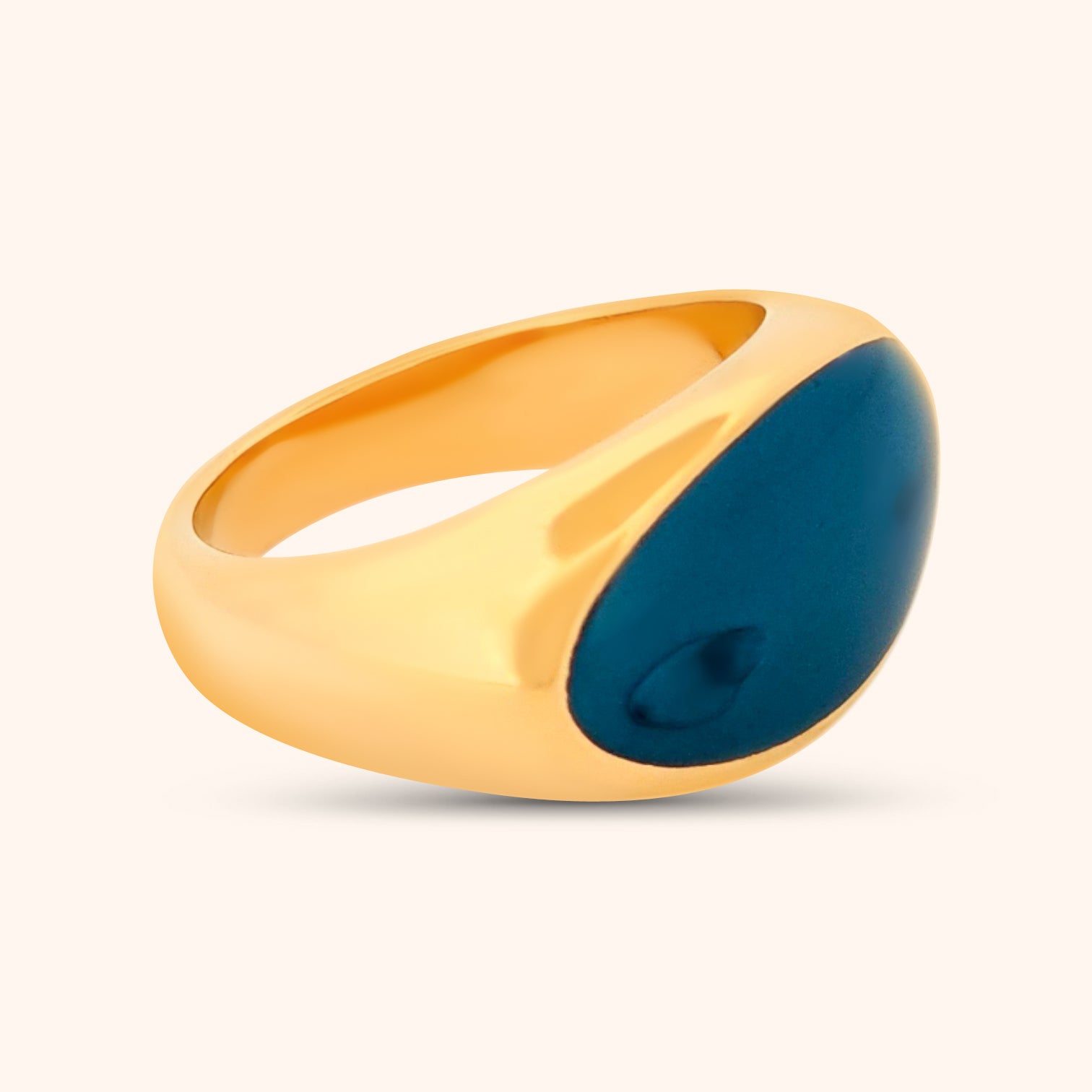 Close-up of The Jaipur Ring, a gold ring featuring a sideways oval Lapis gemstone, showcasing its deep blue color and pyrite inclusions.
