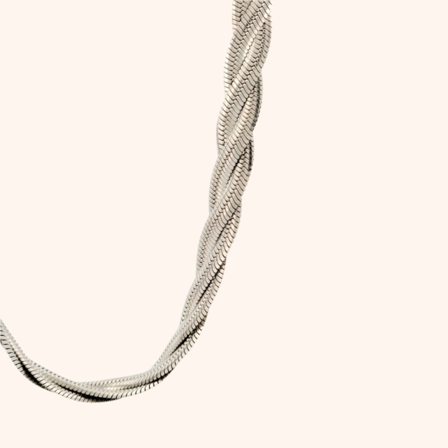 Close-up of the clasp and detailing on a gold twisted herringbone chain necklace, showcasing its quality craftsmanship.